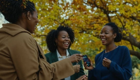 Smile, Outerwear, Temple, Yellow, Happy, Gesture