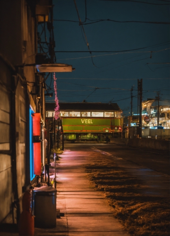 Sky, Automotive Lighting, Electricity, Road Surface, Building, Street Light