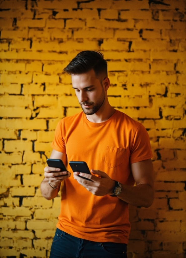 Clothing, Arm, Watch, Orange, Sleeve, Yellow